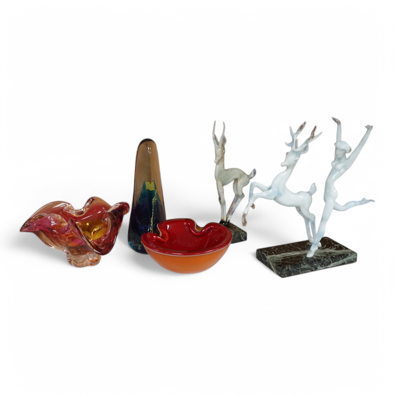 Two Istvan Komaromy glass sculptures, 1950s , one with a dancing lady and stag the other of a deer on a ball, together with a group of three later art glass dishes, tallest 26cm high., Condition - foot to deer on ball ch